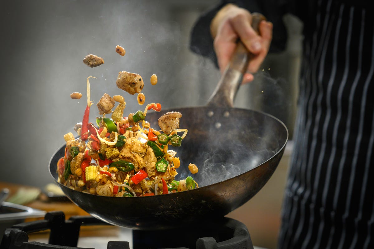 chef preparing food in restaurant kitchen