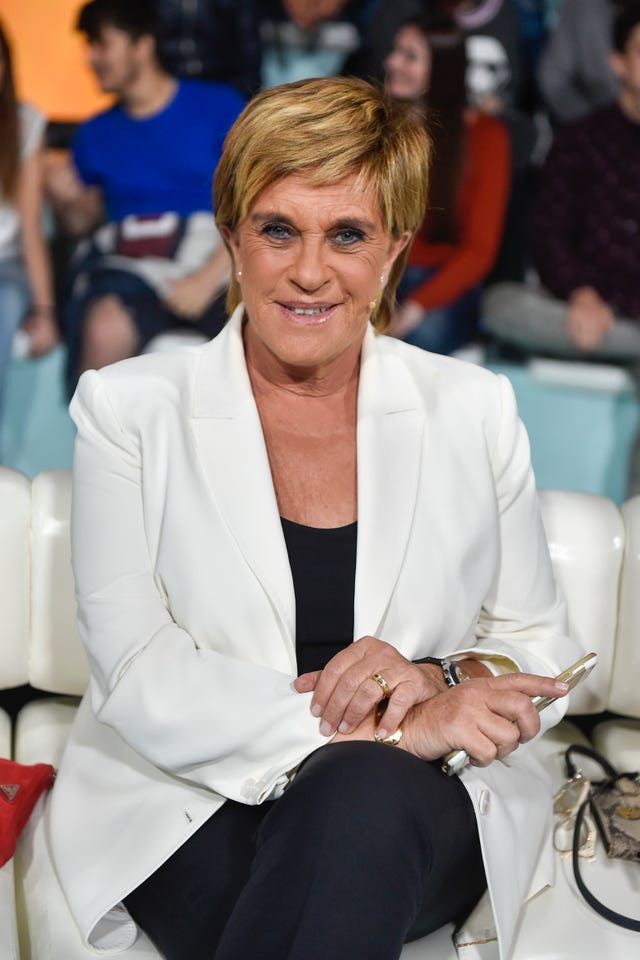 Fashion, Event, Outerwear, Suit, White-collar worker, Sitting, Blazer, 