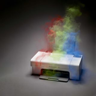 printer machine with rainbow colored smoke coming out of it