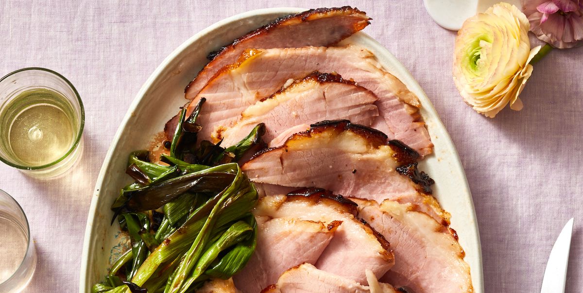 cherry bourbon glazed ham with green onions on the side