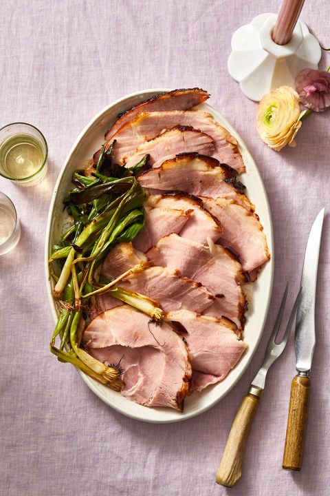 cherry bourbon glazed ham with green onions on the side