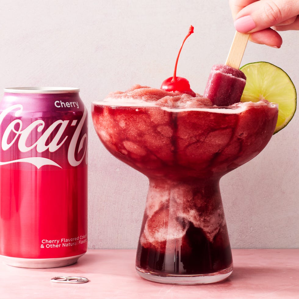 frozen cherry coke margaritas with a lime wheel and popsicles