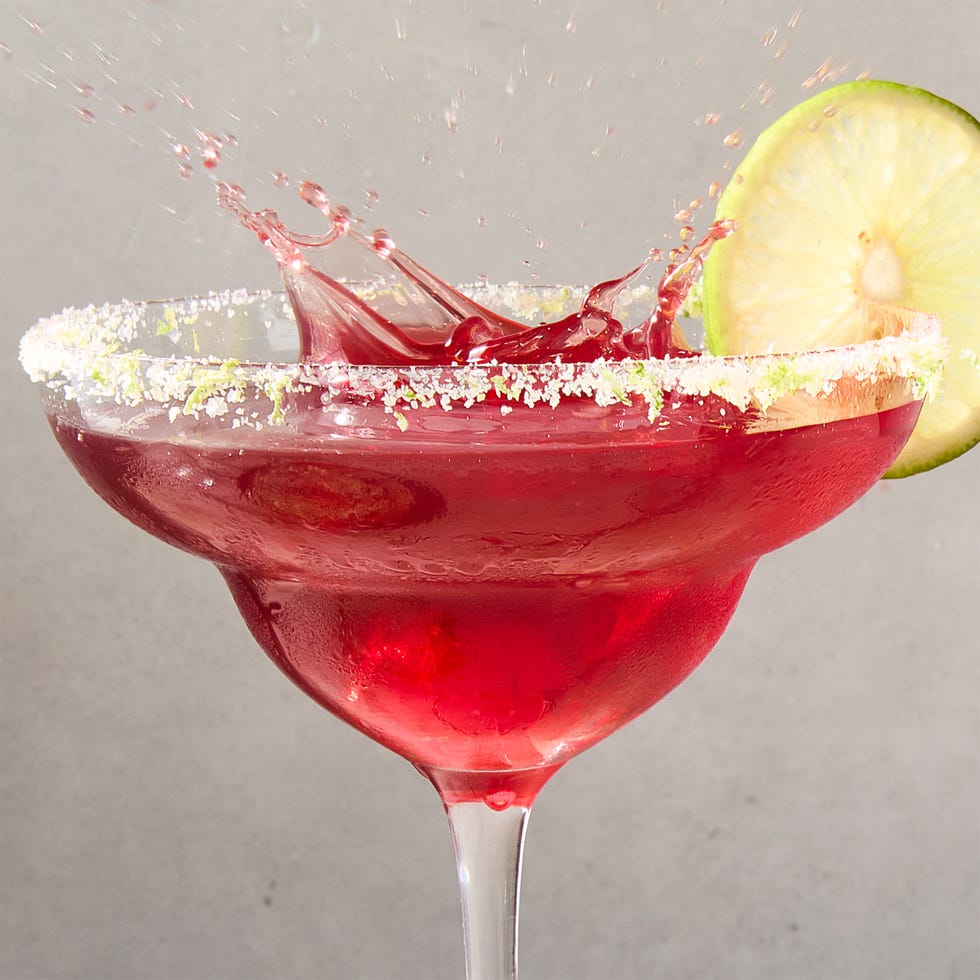 cherry lime margarita with a lime rim and cherry and lime garnish