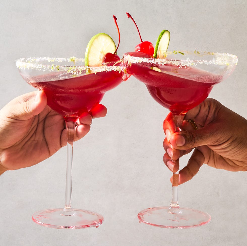 cherry lime margarita with a lime rim and cherry and lime garnish