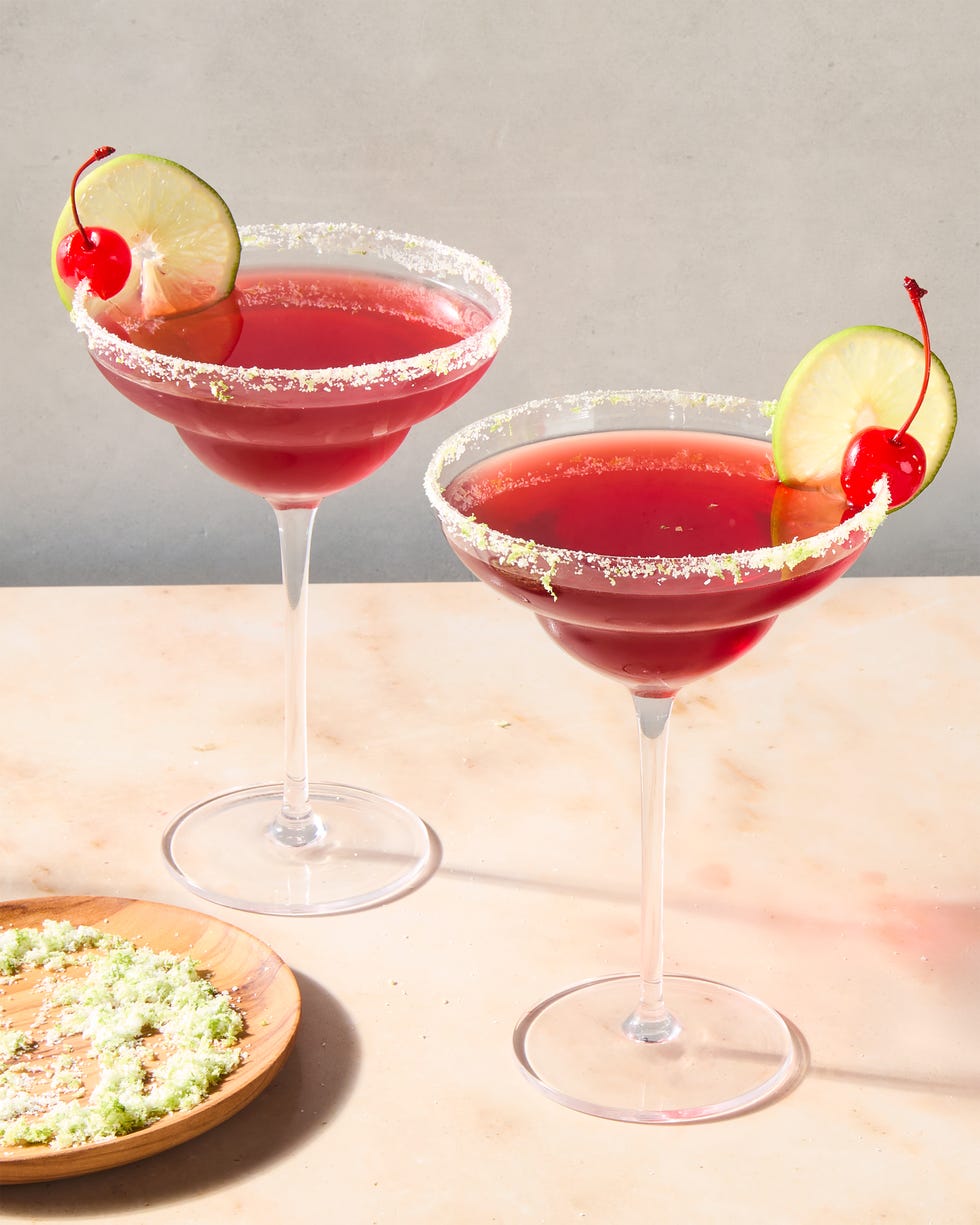 cherry lime margarita with a lime rim and cherry and lime garnish