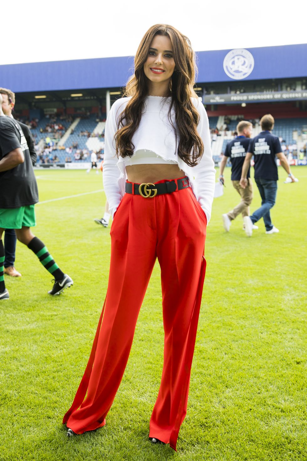 Cheryl Cole wearing long trousers