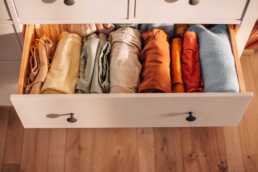 chest of drawers with hand clothes