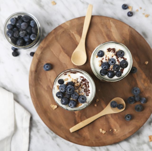 chia pudding parfait with chocolate and yoghurt with blueberries and granola in jars