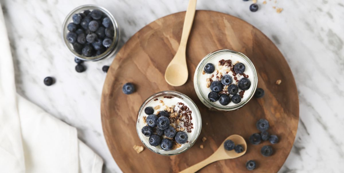 chia pudding parfait with chocolate and yoghurt with blueberries and granola in jars