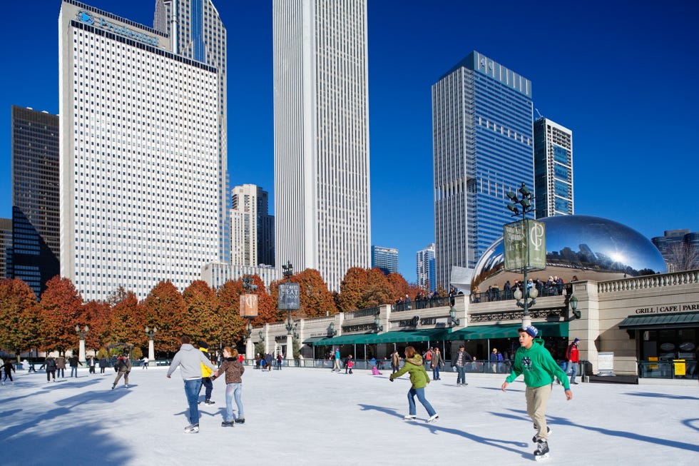 The McCormick Tribune Ice Rink in Millennium Park, Chicago. people ice skating in a city