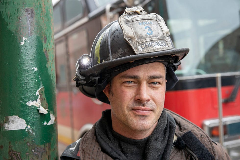 taylor kinney wearing fire uniform in chicago fire