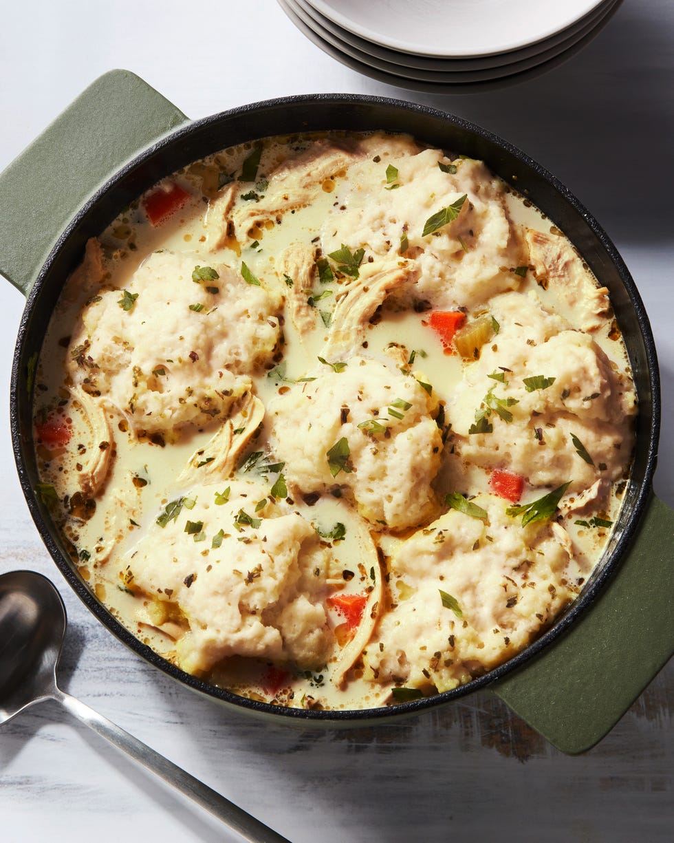 shredded chicken and dumplings in a creamy broth, topped with chopped parsley