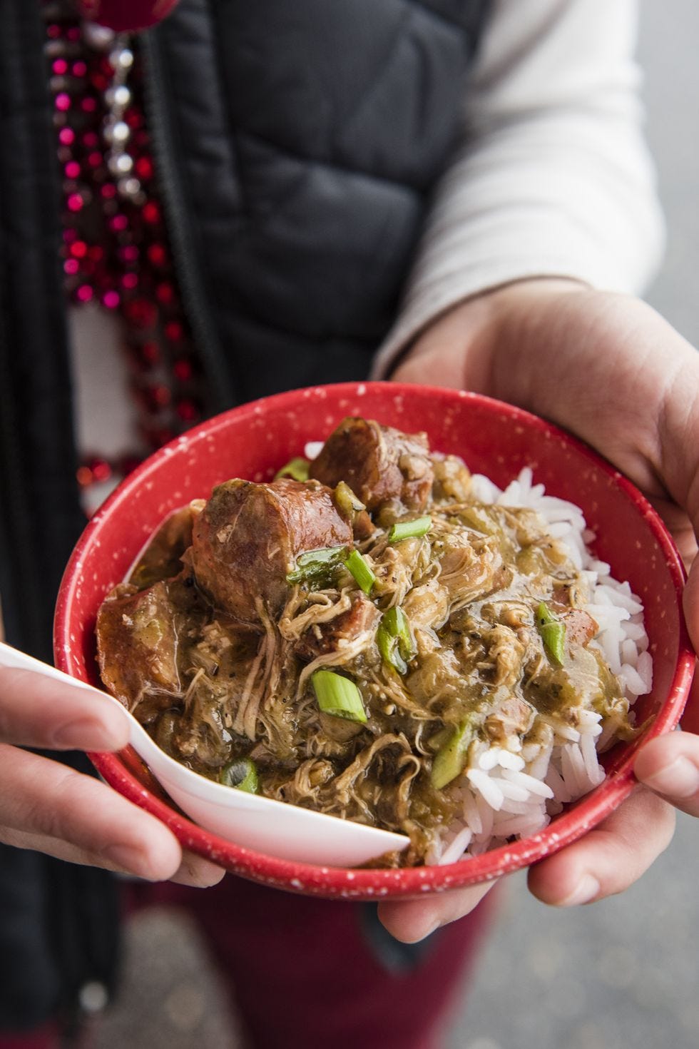chicken and sausage gumbo over rice in a bowl
