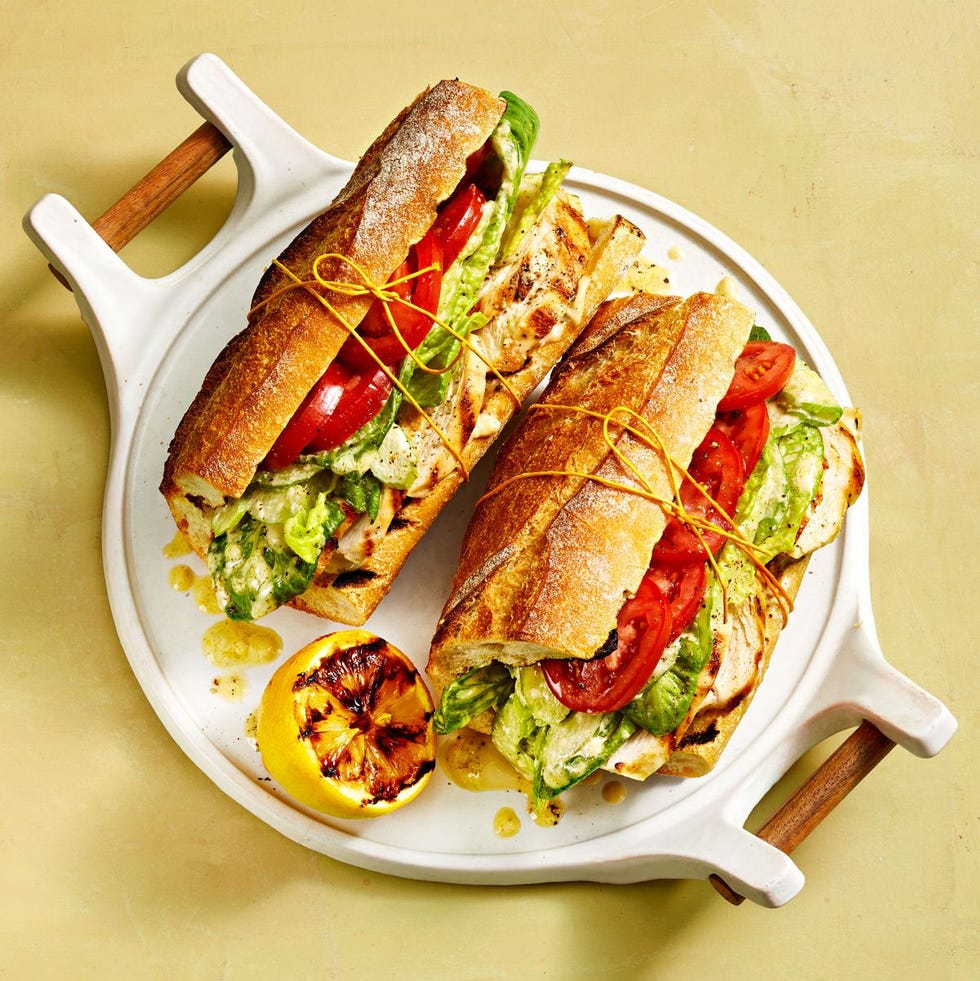 chicken caesar baguettes on a white plate
