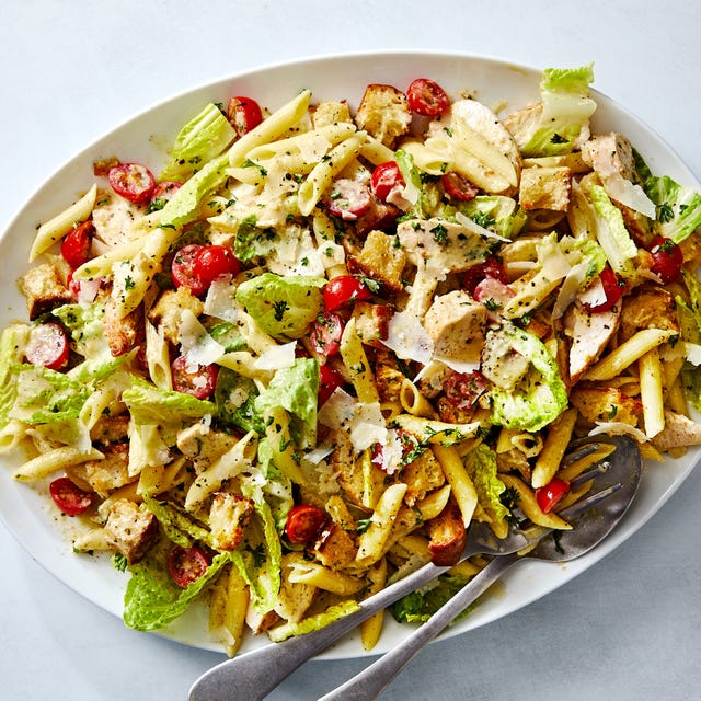 Chicken Caesar Pasta Salad chicken caesar pasta salad with chicken, tomatoes, penne pasta, and parmesan all tossed in creamy caesar dressing