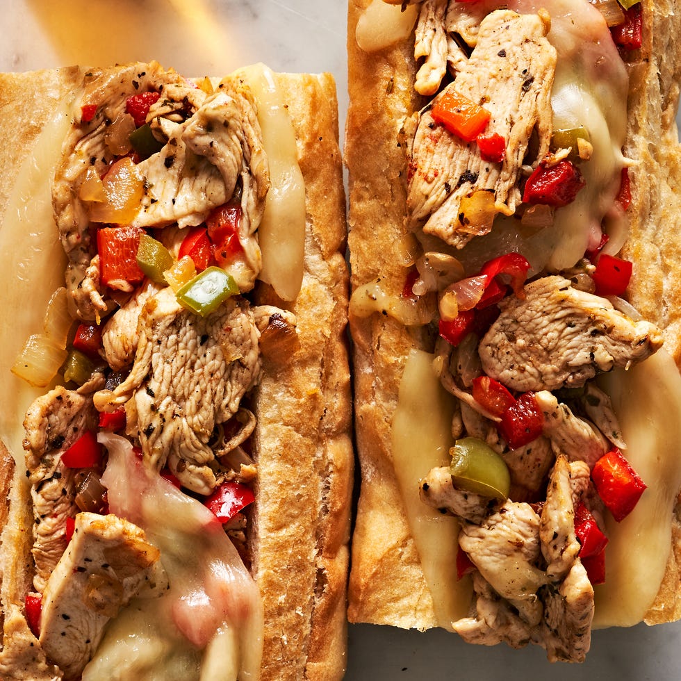 cheesesteaks filled with chicken, cheese, and peppers