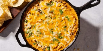 chicken enchilada dip dipped with chips