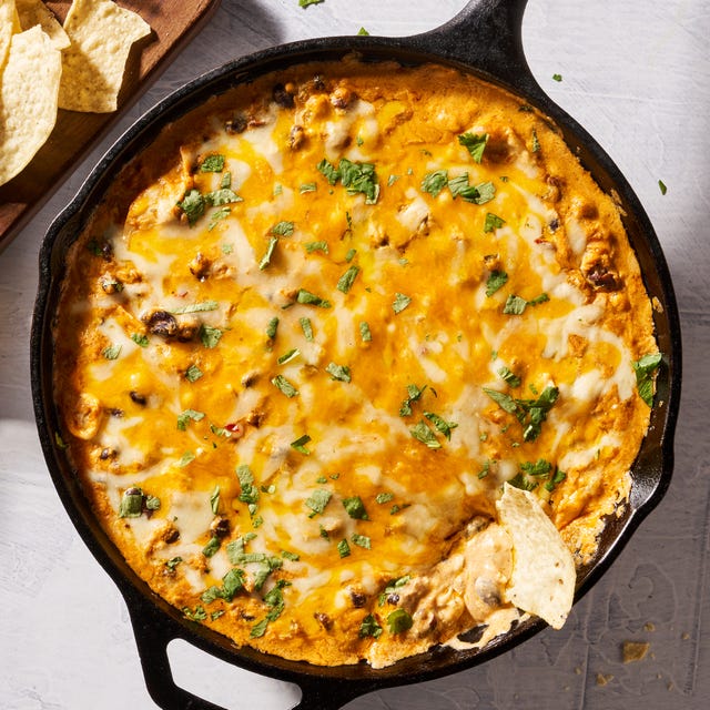 chicken enchilada dip dipped with chips