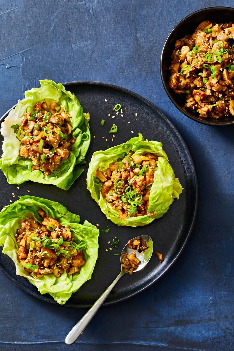 chicken lettuce wraps on a black plate