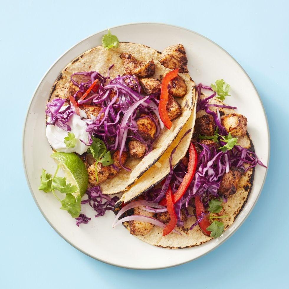 chicken mole tacos with purple cabbage on top