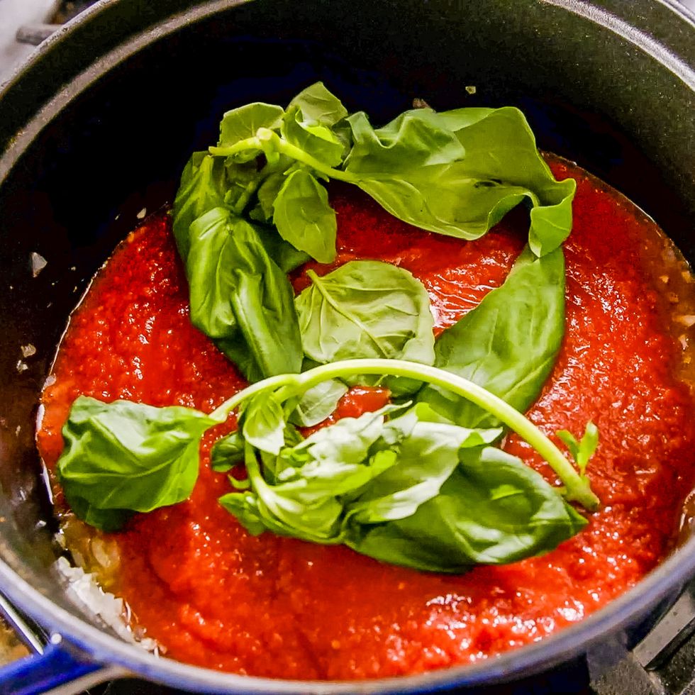 tomato sauce in a pot with basil