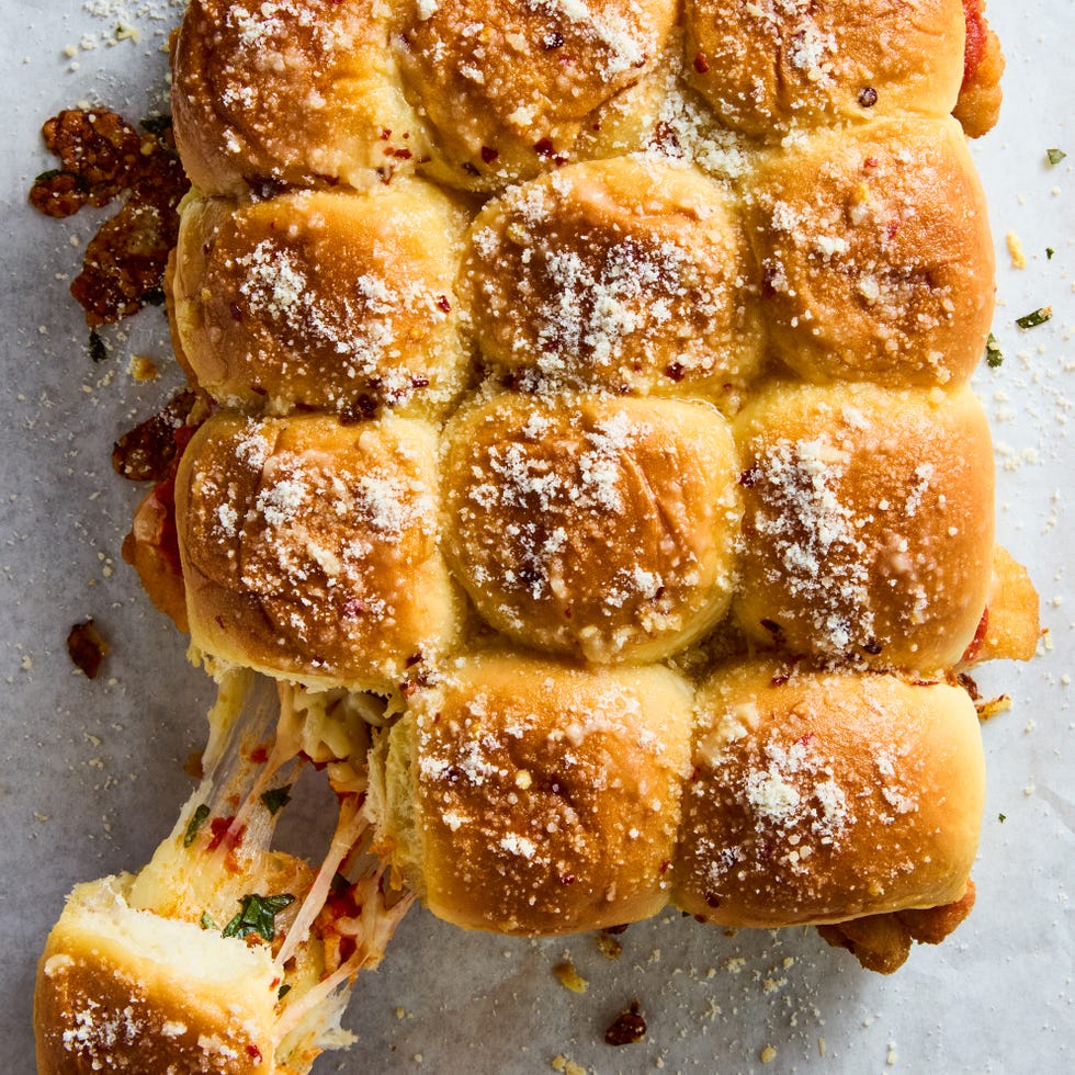 breaded chicken topped with cheese and marinara in slider buns