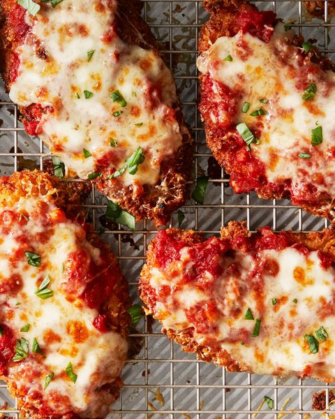 chicken parmesan covered with melty cheese and fresh herbs