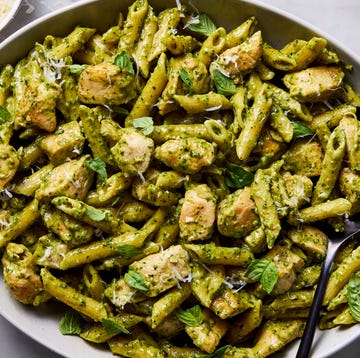 Chicken pesto pasta chicken pesto pasta topped with basil and parmesan cheese