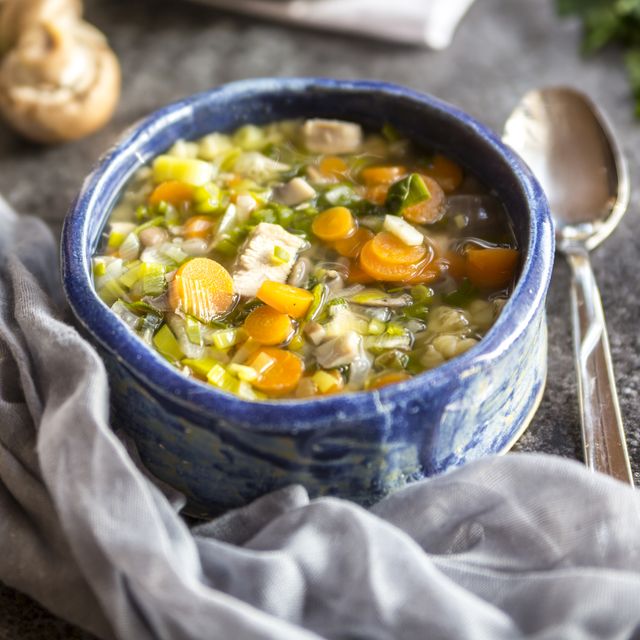 Chicken soup with leek, carrots, noodles, spring onions, champignons and parsley