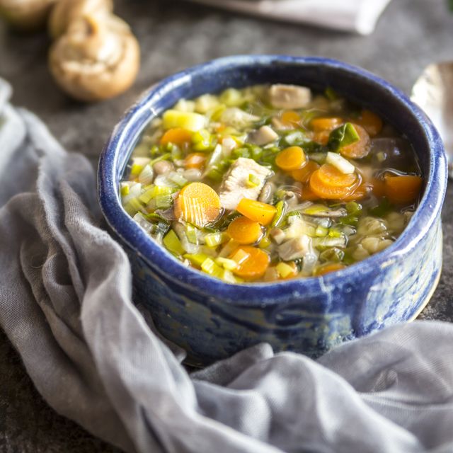 chicken soup with leek, carrots, noodles, spring onions, champignons and parsley