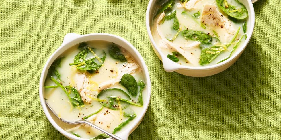 greek lemon and spinach soup in white bowls