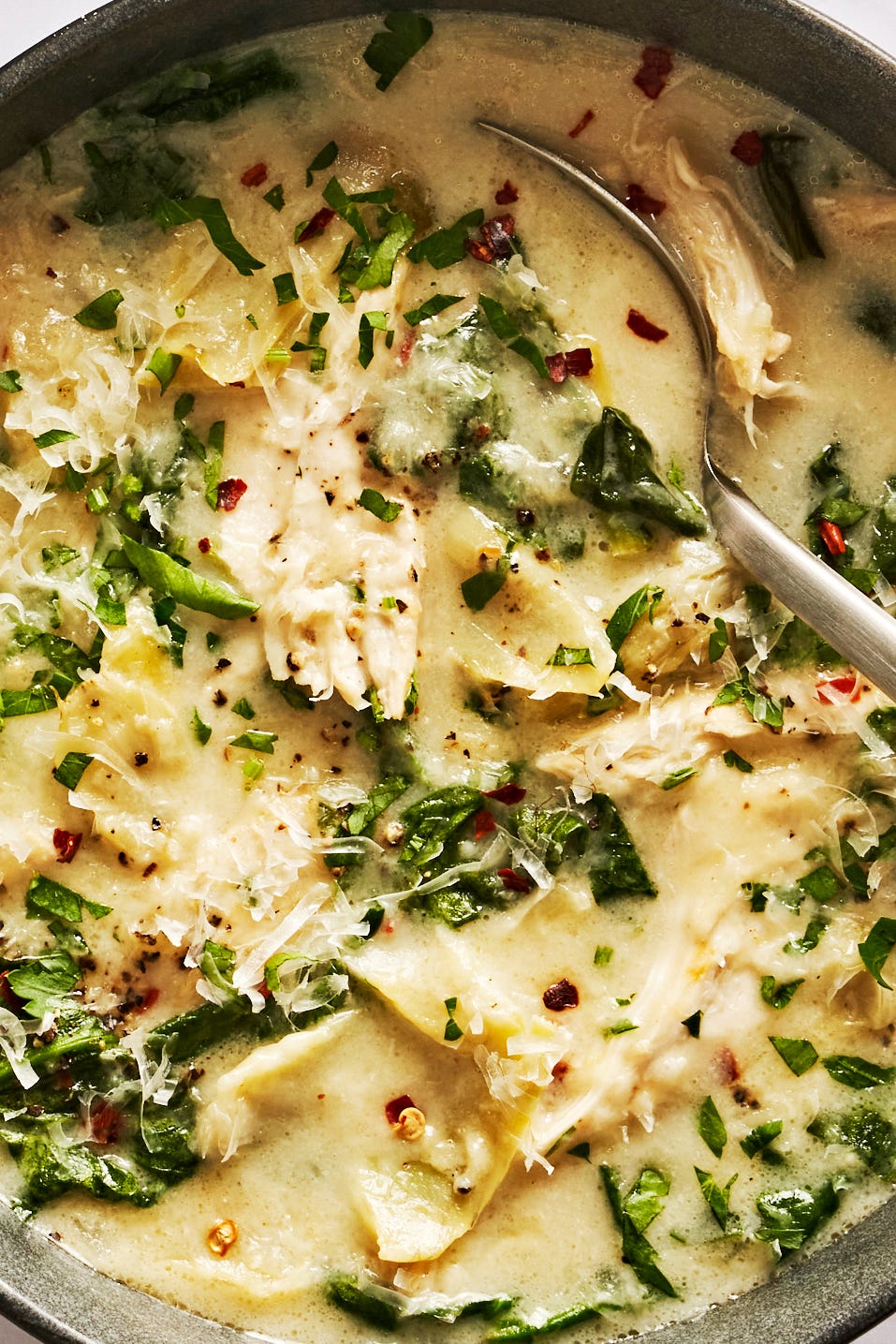 Chicken Spinach Artichoke Soup creamy chicken spinach artichoke soup in a gray bowl