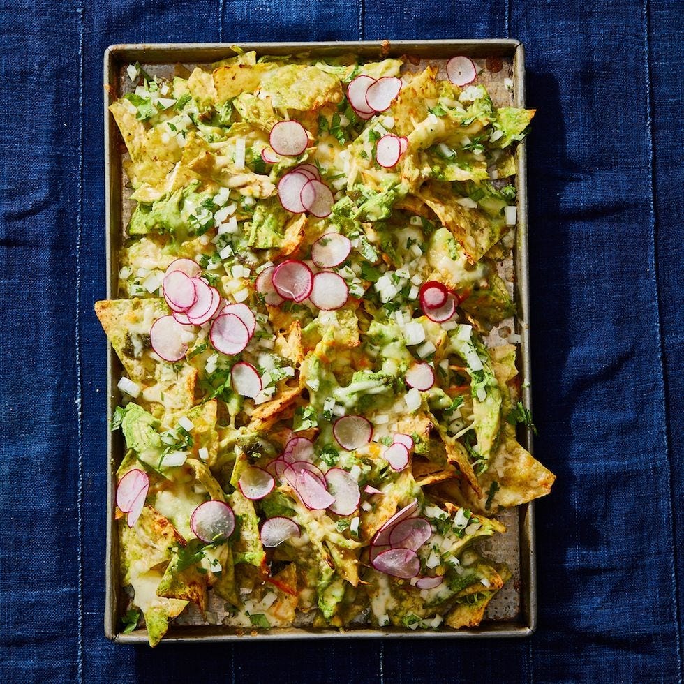 chicken suizas nachos on a baking sheet