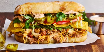 shredded chicken, veggies, and tortilla chips between two slices of bread