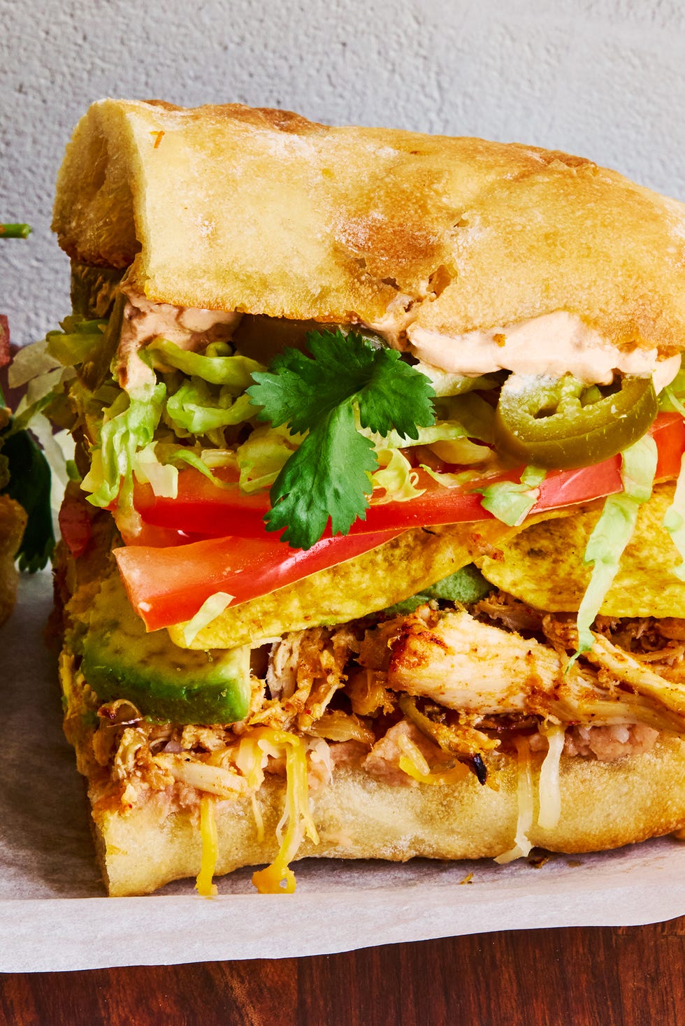 shredded chicken, veggies, and tortilla chips between two slices of bread