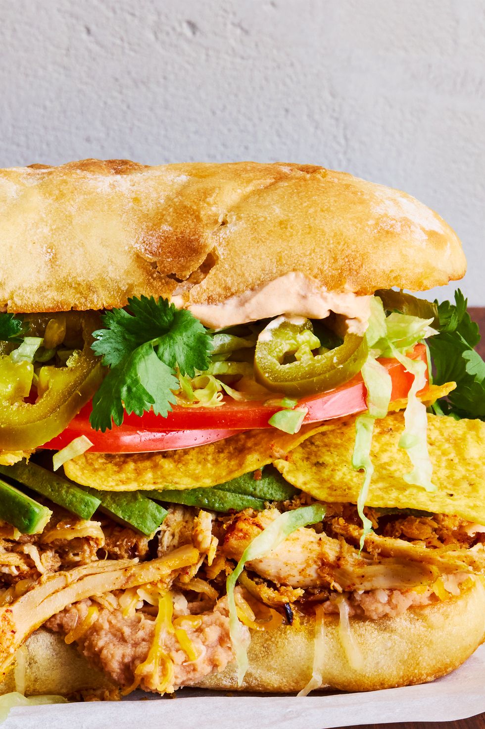 shredded chicken, veggies, and tortilla chips between two slices of bread