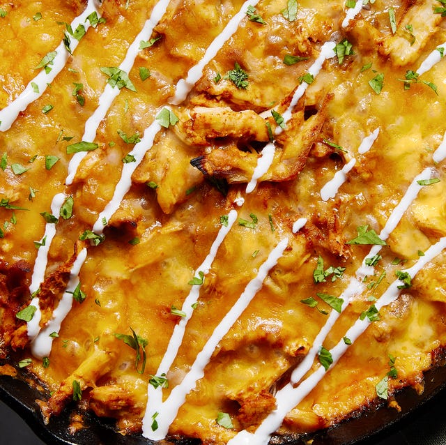 chicken tamale pie in a skillet with sour cream