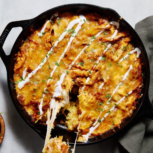 chicken tamale pie in a skillet with sour cream