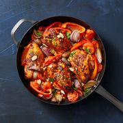 chicken with stewed peppers in skillet