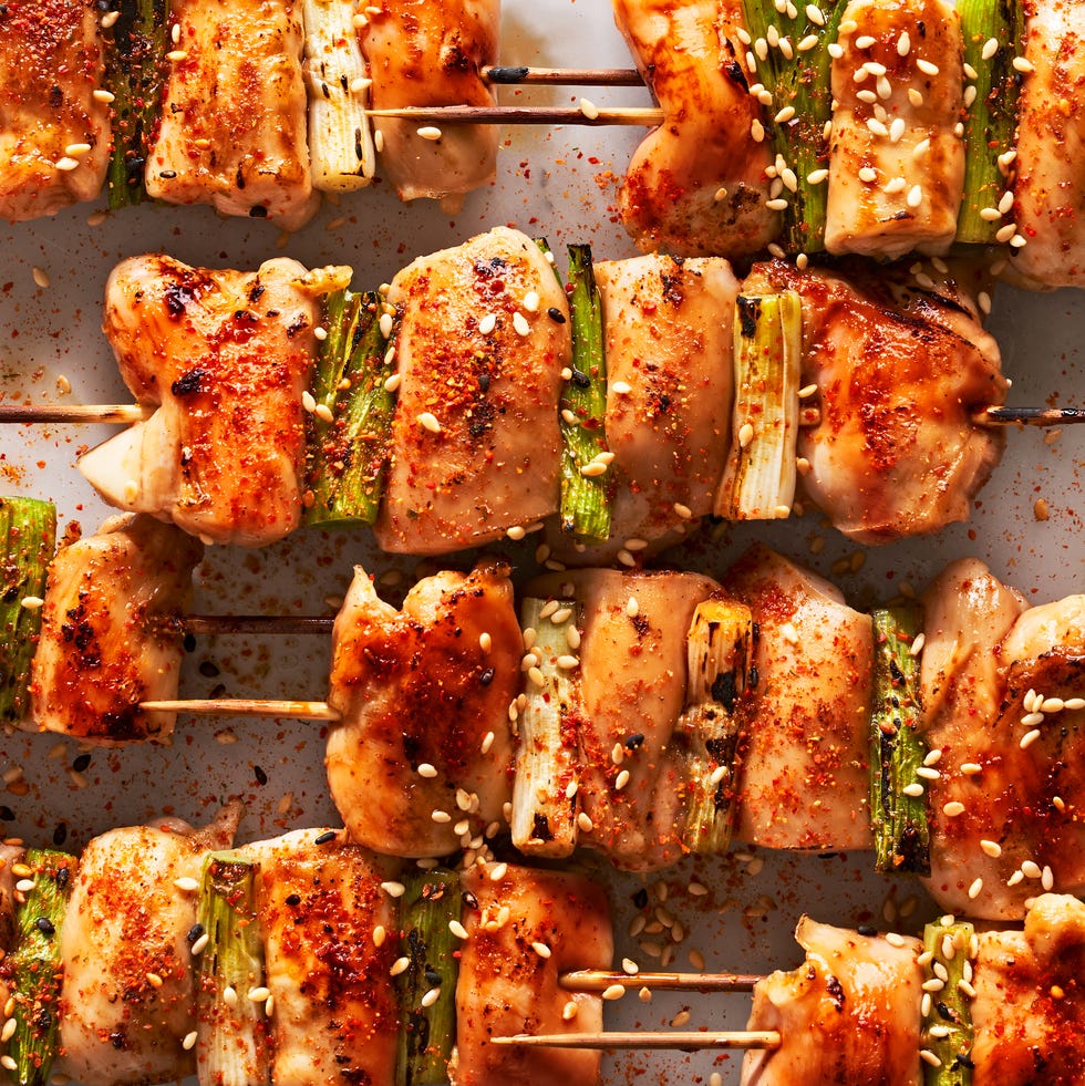 chicken on a skewer with scallions and seasoning