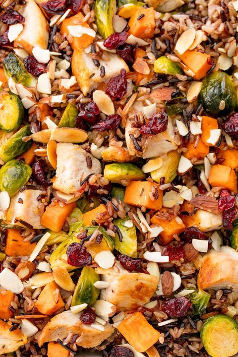 close up of harvest chicken wild rice salad with cranberries, brussels sprouts, butternut squash, and sliced almonds