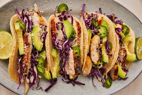 four tequila lime chicken tacos on a plate