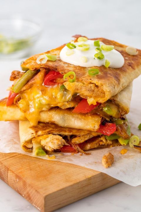 stack of chicken quesadillas with peppers and avocado