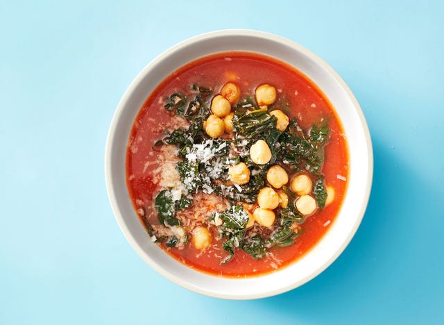 kale and chickpea soup on a blue background kale and chickpea soup on a blue background