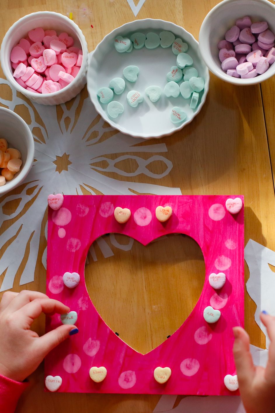 a child making a picture frame for valentine's day