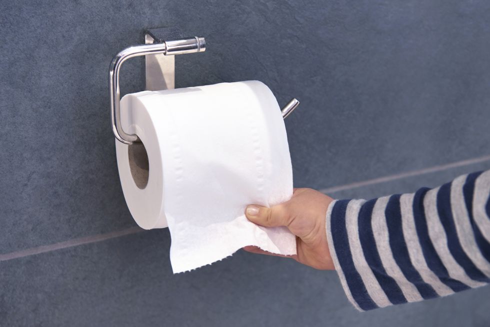 child pulling toilet roll