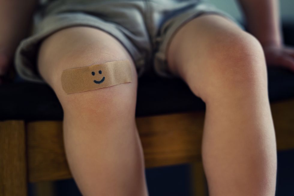 child with a plaster on knee
