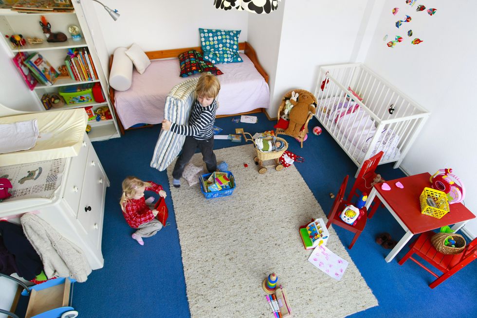 children cleaning up messy nursery