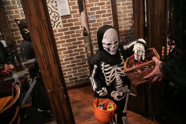 new yorkers celebrate halloween in the city
