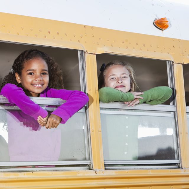 children looking out school bus window